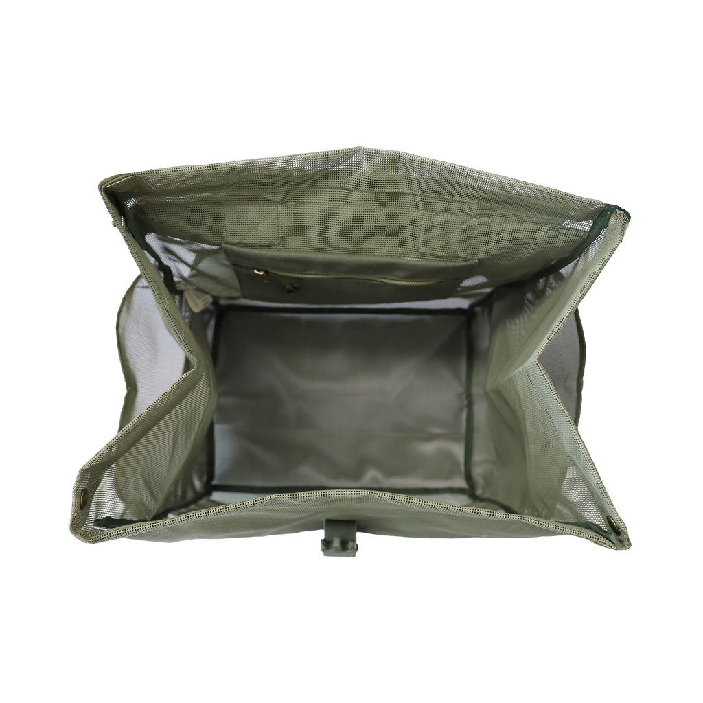 A studio image of the Sande Beach Hauler mesh backpack in Pandanus Green, shown from the top to highlight its practical internal design. This view showcases the internal canvas pocket with a key clip and a large internal mesh pocket, perfect for organising beach essentials. The backpack durable mesh fabric is an ideal choice for beach trips and outdoor adventures. Set against a white background, this functional design ensures convenience.