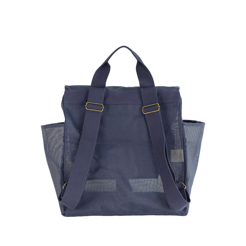 This studio image shows the Sande Beach Hauler mesh backpack in Deep Sea Navy from the rear view. The image highlights the adjustable backpack straps for a customised fit, thick cotton canvas for comfortable carrying, and sturdy mesh material, ensuring durability and practicality for everyday use.