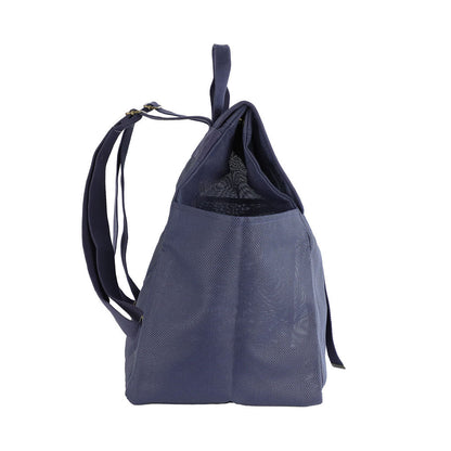 This studio image shows the Sande Beach Hauler mesh backpack in Deep Sea Navy from the side view. The image highlights the adjustable straps for a comfortable fit, a side mesh pocket for easy storage, and the sleek design of the bag, making it both practical and stylish.