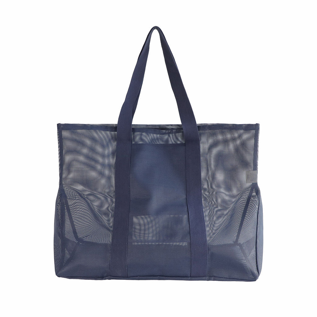 Oversized Sande Beach Hauler mesh beach bag in Deep Sea Navy, displayed in a studio setting. Shown from the rear to highlight the breathable mesh design, thick cotton straps. Set against a white background.