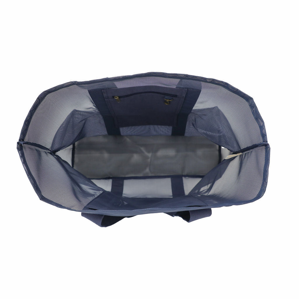 Oversized Sande mesh beach bag in Deep Sea Navy, displayed in a studio setting. Shown from the top to reveal the spacious interior, featuring a secure canvas pocket for valuables, a handy key clip, and a large mesh pocket for extra storage. Set against a white background.