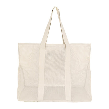 Rear view of the Sande Kids original oversized mesh beach bag in neutral, highlighting its large capacity and durable mesh construction.