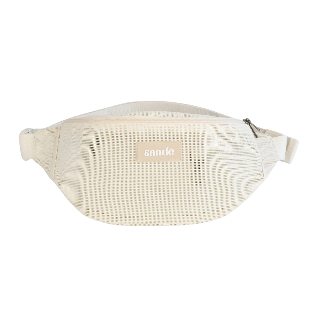 Front view of the Sande Essentials Crossbody Bag in Sand, featuring mesh fabric, a silicone Sande logo and a YKK zip, displayed on a white background.