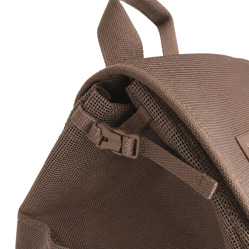 Close uo view of the Sande Beach Hauler mesh backpack in Espresso chocolate brown, showing the small side clip used to compress the bag.
