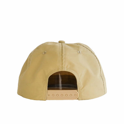 A beige cap made from waterproof nylon fabric, shown from the rear. The cap features a plastic snapback and the Sande logo embroidered in white on the front.