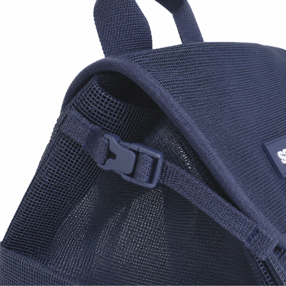 Close-up of a navy blue mesh backpack with a strap and clip detail on the side to compress the bag on a white background