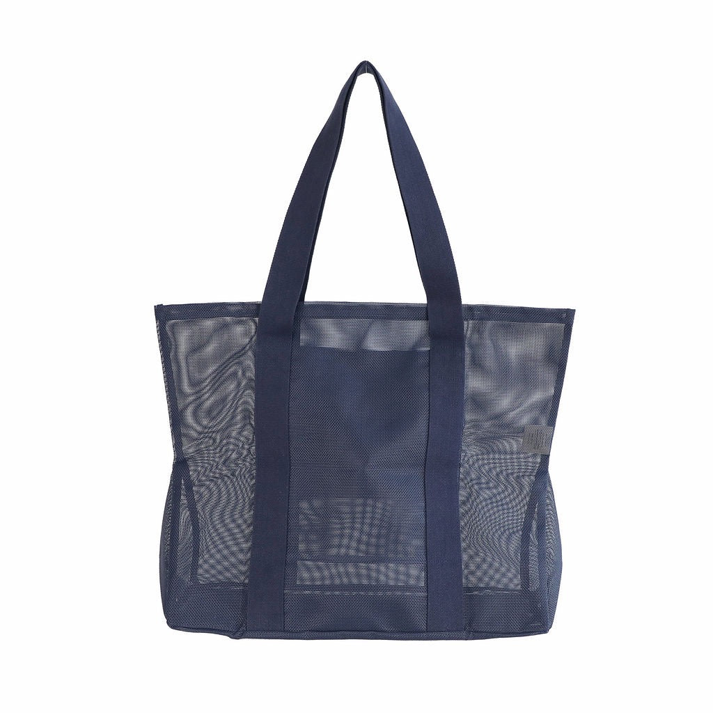 Sande Beach Hauler - large mesh beach bag in Deep Sea Navy, displayed in a studio setting from the rear. This view highlights the breathable mesh design, thick cotton straps, and durable construction. Set against a white background.