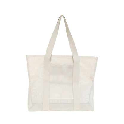 Rear view of the Sande Beach Hauler Mini in Sand colorway on a white background. This durable mesh beach bag is designed for functionality and style, featuring a spacious interior perfect for carrying beach essentials on family outings.