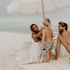 Family enjoying a day at the beach with their Sande™ Beach Hauler in Sand, highlighting the bag&
